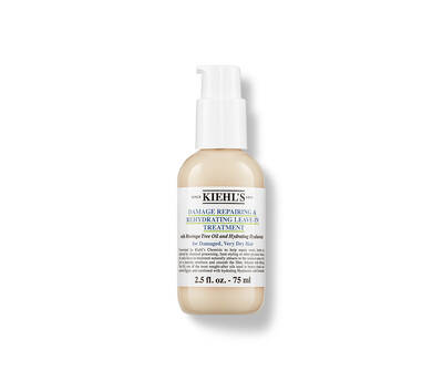 Kiehl's Damage Repairing & Rehydrating Leave-In Treatment in a beige bottle, designed for repairing damaged hair.