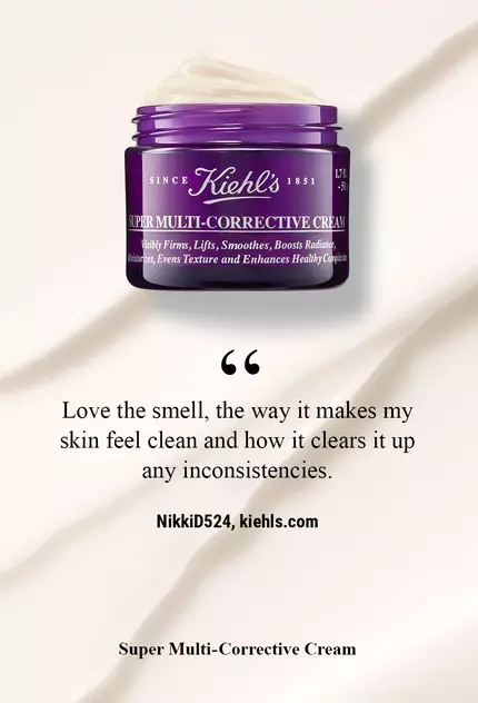 A jar of Kiehl's Super Multi-Corrective Cream on a smooth, cream-colored background, accompanied by a user testimonial praising its pleasant scent and skin-cleansing properties.