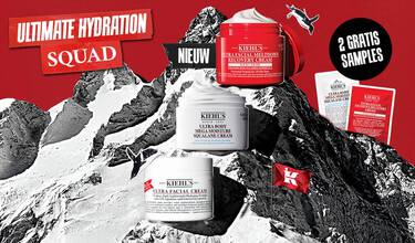 Kiehl's banner met de Ultra Facial-collectie op een besneeuwde bergtop. Je ziet de Ultra Facial Cream, Meltdown Recovery Cream en Mega Moisture Squalane bodycreme, met de tekst '2 gratis samples bij je bestelling'.