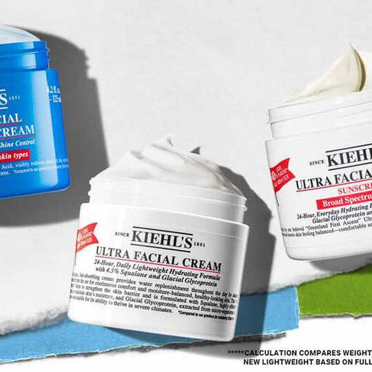 Drie huidverzorgingsproducten van Kiehl's: Ultra Facial Fresh Gel Cream in blauw en twee Ultra Facial Creams met zonnebrandcreme, allemaal met etiket.