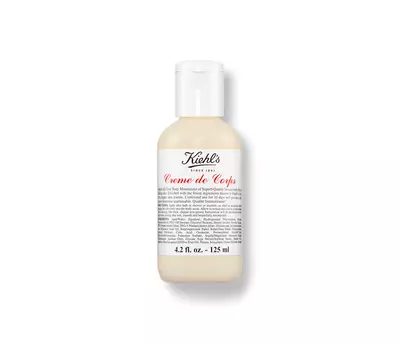 A small bottle of Kiehl's Creme de Corps body moisturizer, labeled with product details, 4.2 fl oz size.