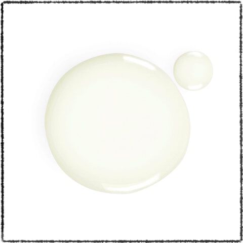 A large and a small droplet of a light, translucent liquid on a white background.