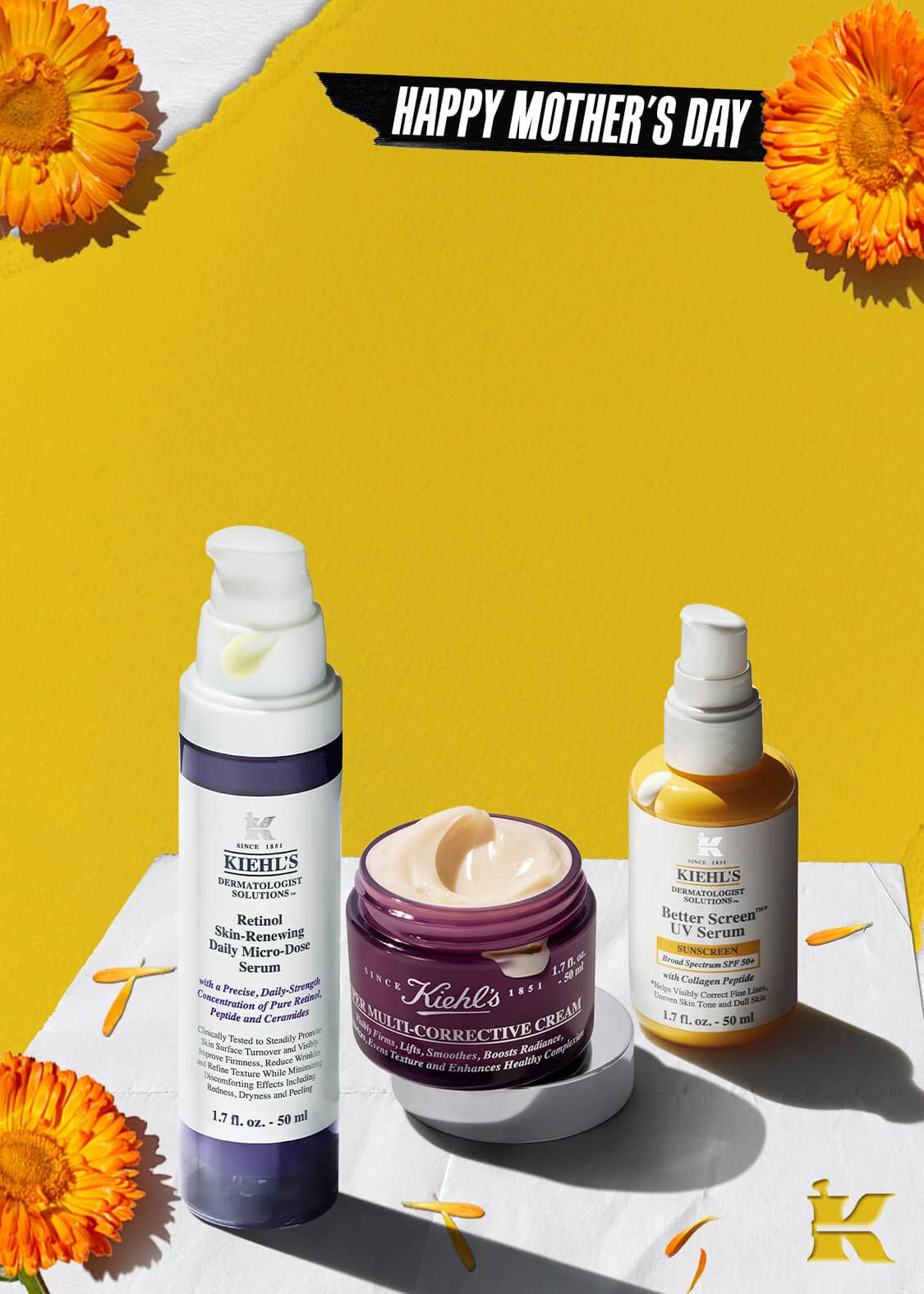 Moederdag cadeau inspiratie met de Age-Less Experts giftset omringd door bloemen en een 'Love You Mom' stempel.