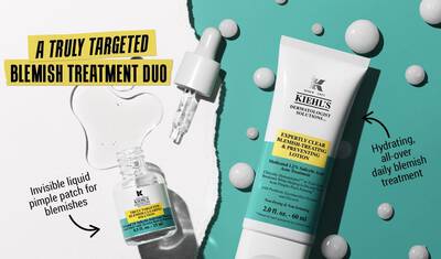 Alt text: An advertisement for Kiehl's acne treatment duo featuring a dropper bottle of invisible liquid pimple patch and a tube of acne-fighting lotion, with text highlighting their targeted and hydrating properties.