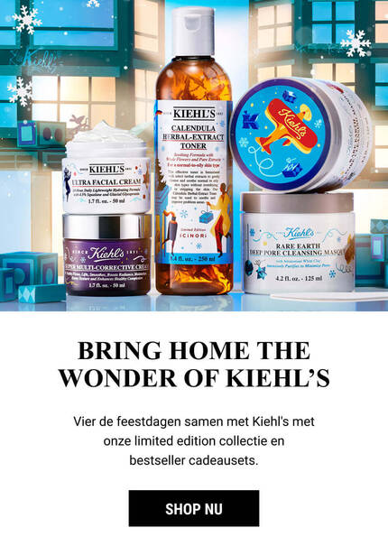 A festive display featuring Kiehl's limited edition holiday skincare products, including lotions and creams, set against a wintry backdrop with snowflakes and festive decorations.