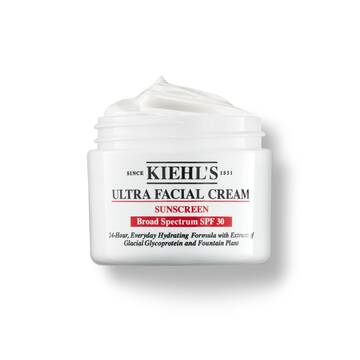 Een pot van 125 ml Kiehl's Ultra Facial Cream SPF 30 met opgeklopte textuur tegen een witte achtergrond.