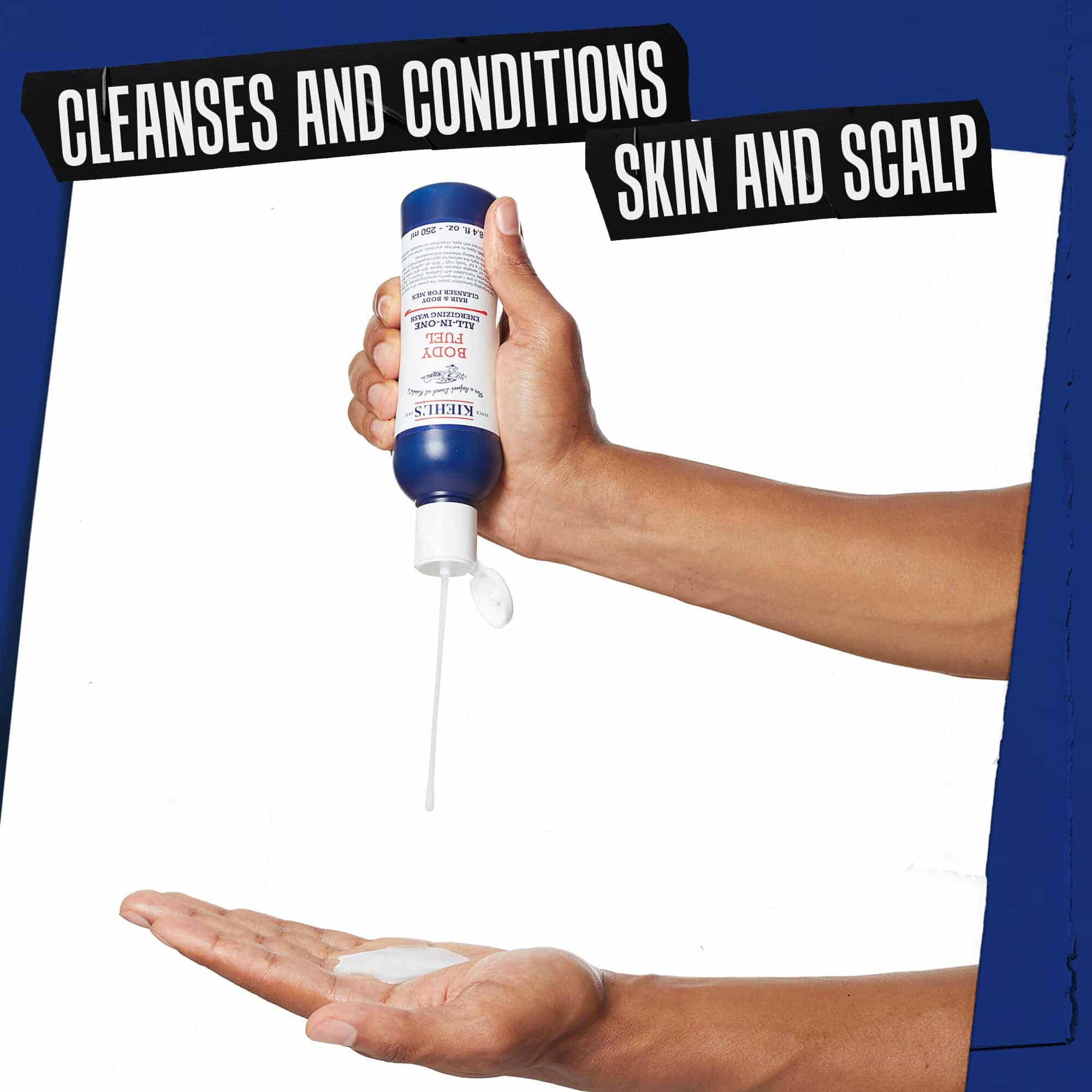 Hand doseert Body Fuel All-In-One Energizing Wash; reinigt en verzorgt huid en hoofdhuid.