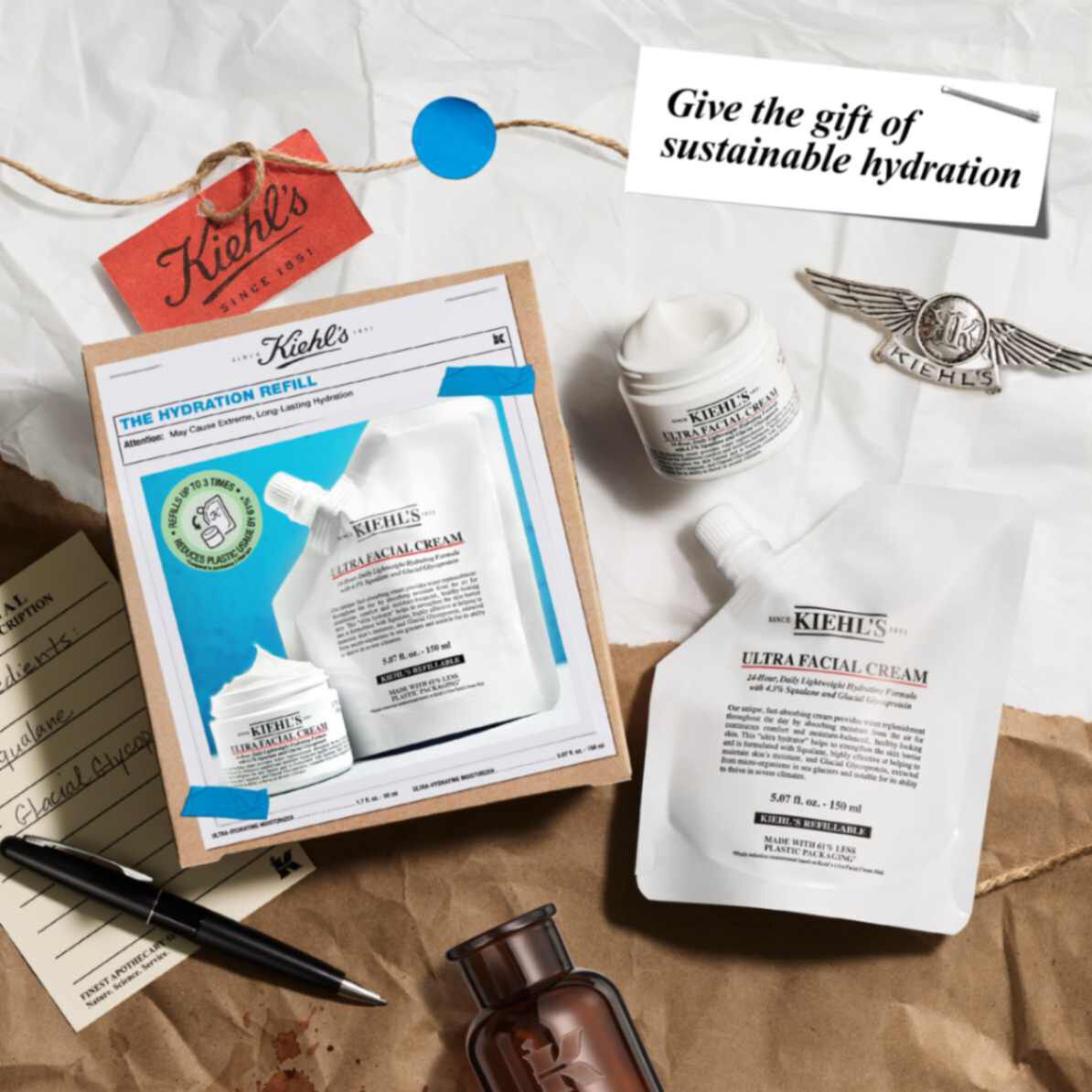 The Hydration Refill Gift Set on top of paper with elements scattered around​