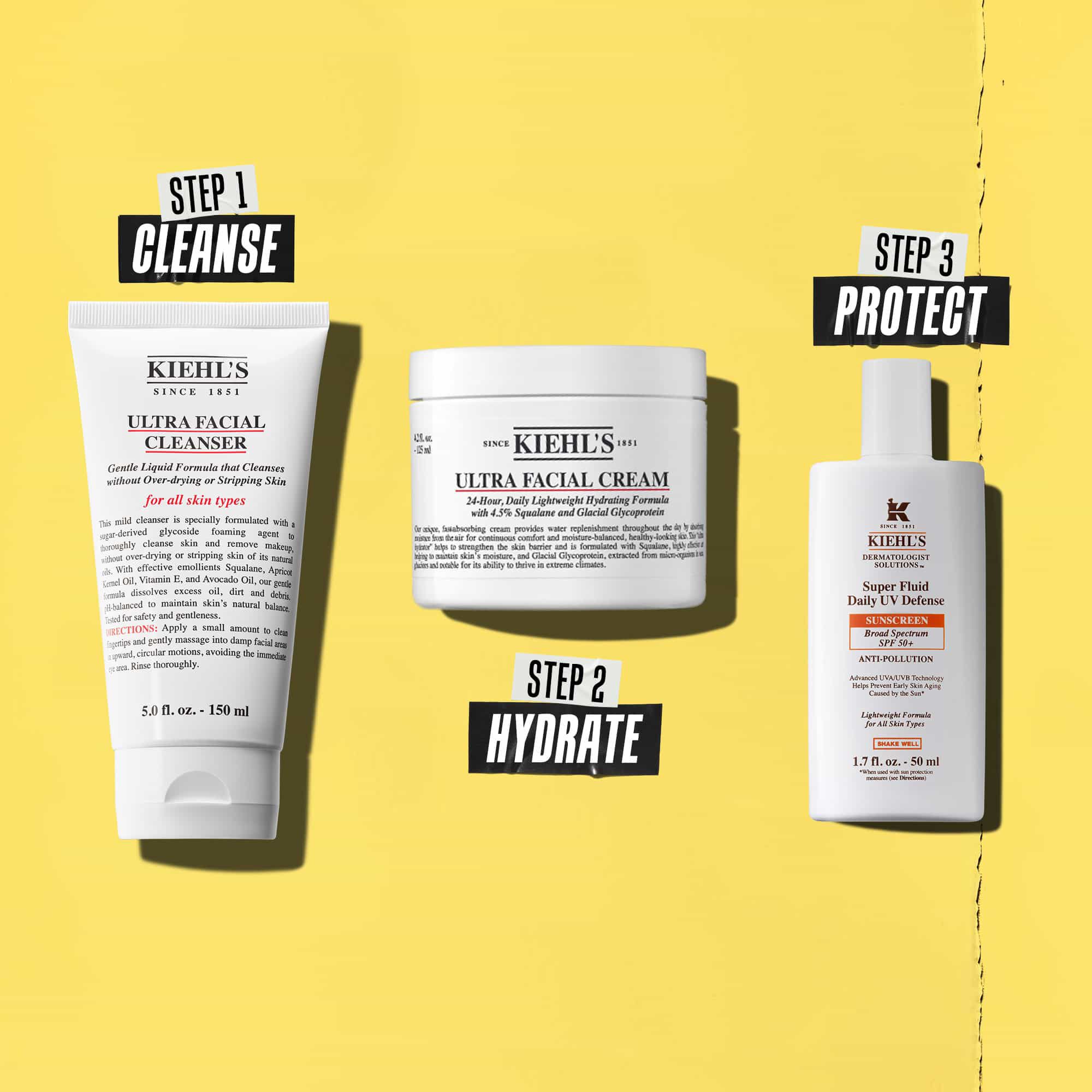 Drie Kiehl's producten die een routine vertegenwoordigen. Van links naar rechts: reiniger, vochtinbrengende creme en zonnebrandcreme.